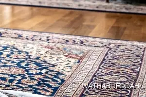 فريق وثاب جدة أثناء تنظيف سجاد في حي الأصالة بجدة