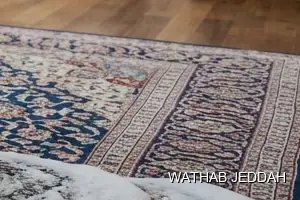 فريق وثاب جدة أثناء تنظيف سجاد في حي المنار بجدة