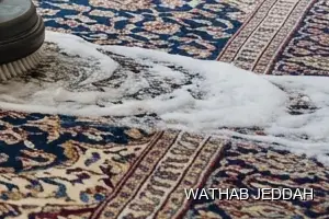 فريق وثاب جدة أثناء تنظيف سجاد في حي غليل بجدة