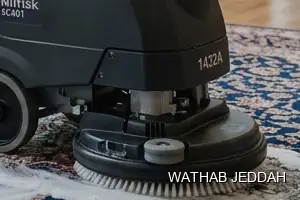 فريق وثاب جدة أثناء تنظيف موكيت في حي المنتزهات بجدة
