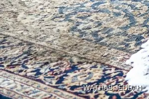 فريق وثاب جدة أثناء تنظيف موكيت في حي الورود بجدة